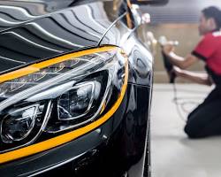 Image of Car exterior being washed and polished